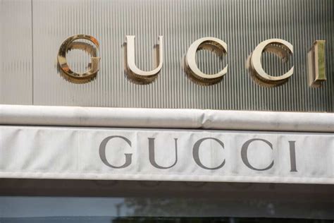 gucci owned by.